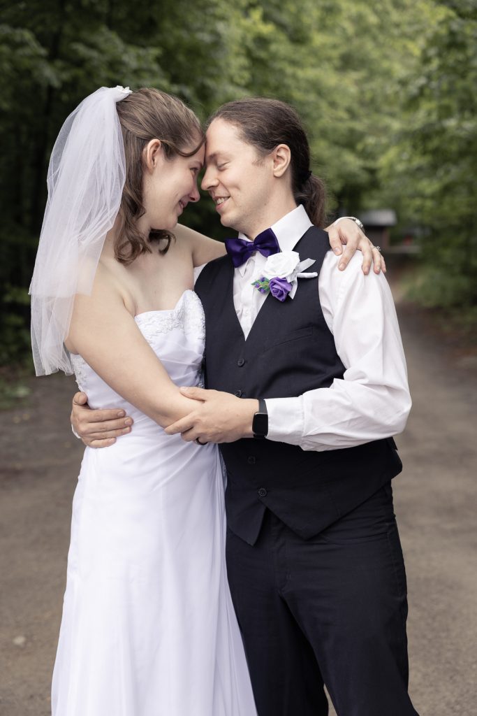 Married couple standing close together Posing for wedding photos. shot outside Ottawa