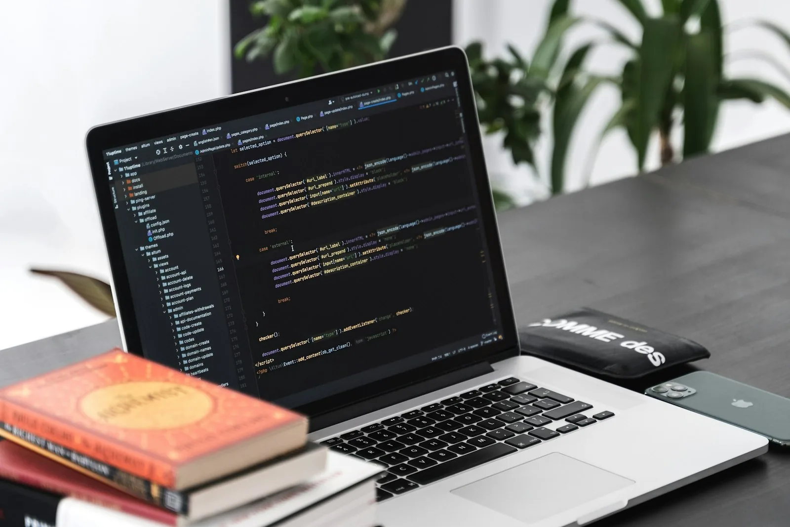 Laptop showing a custom WordPress website build, clean code visible in editor